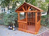 Детский домик с лавочками.
